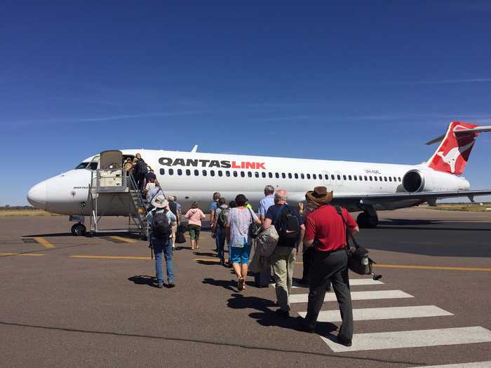 Passengers boarding airplane